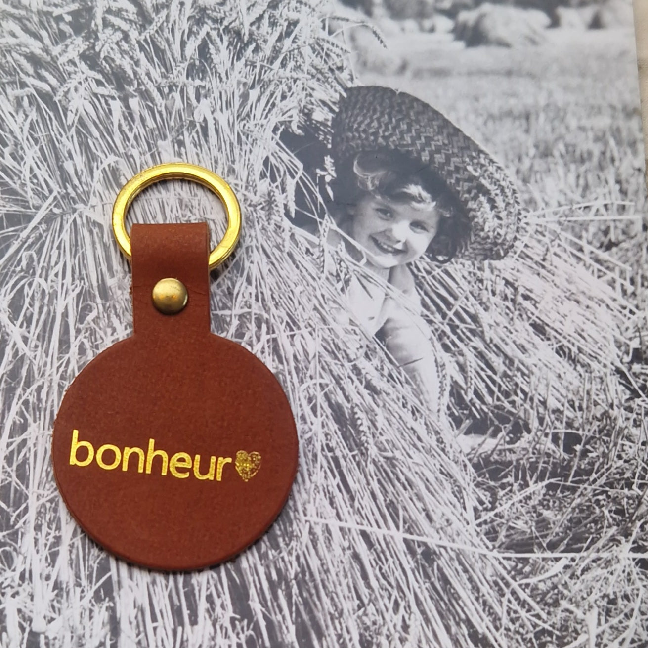 Porte clés rond cuir Bonheur