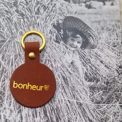Porte clés rond cuir Bonheur
